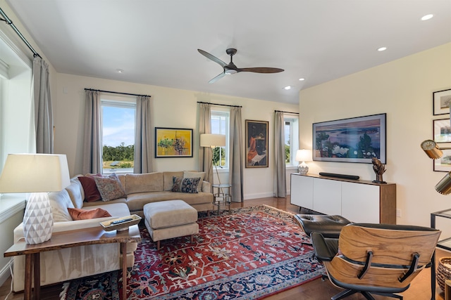 living room with healthy amount of natural light, ceiling fan, recessed lighting, and baseboards