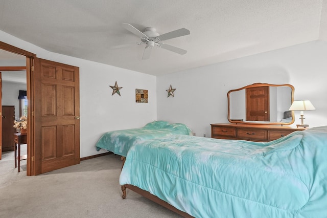 bedroom with light colored carpet and ceiling fan