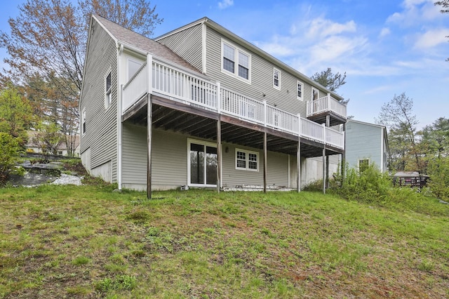 back of property featuring a wooden deck