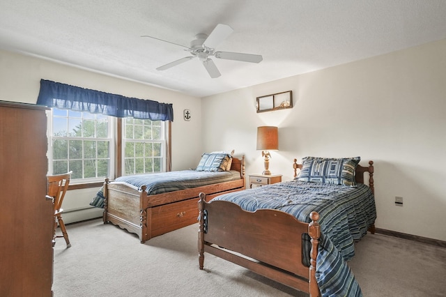 bedroom with light carpet, ceiling fan, a baseboard heating unit, and baseboards