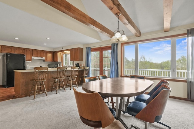 dining space with light colored carpet, beam ceiling, recessed lighting, and baseboards