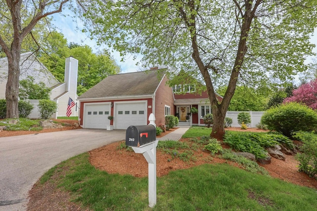 203 Straw Hill Rd, Manchester, NH 03104 - view of front of home featuring an attached garage, driveway, fence, and a chimney