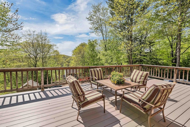 wooden deck featuring an outdoor hangout area