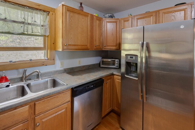273 Berkshire Rd, Lisbon, NH 03585 - kitchen featuring appliances with stainless steel finishes, a sink, and light wood-type flooring