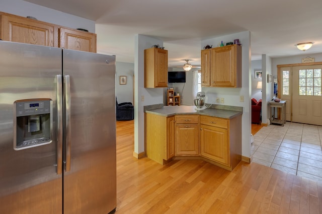 273 Berkshire Rd, Lisbon, NH 03585 - kitchen with stainless steel fridge, light wood-type flooring, ceiling fan, and baseboards