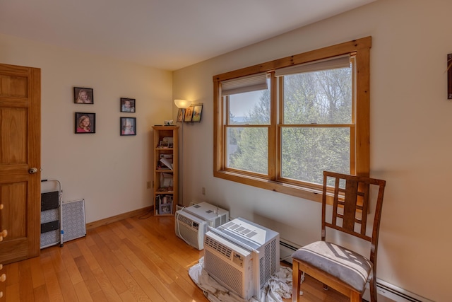 273 Berkshire Rd, Lisbon, NH 03585 - sitting room with a baseboard radiator, light wood-style flooring, and baseboards