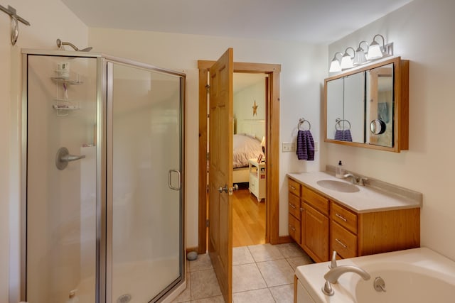 273 Berkshire Rd, Lisbon, NH 03585 - full bath featuring a stall shower, vanity, ensuite bathroom, tile patterned floors, and a garden tub