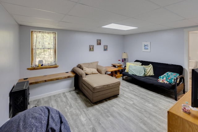 273 Berkshire Rd, Lisbon, NH 03585 - living area with a drop ceiling, wood finished floors, and baseboards