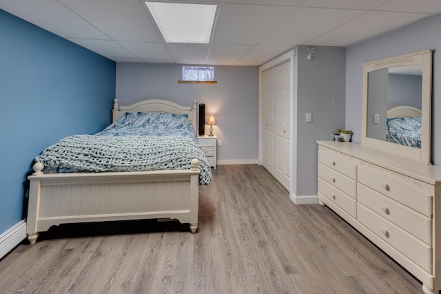 273 Berkshire Rd, Lisbon, NH 03585 - bedroom with wood finished floors, a drop ceiling, baseboards, a closet, and a baseboard radiator