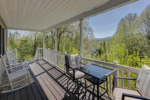 273 Berkshire Rd, Lisbon, NH 03585 - deck featuring a wooded view and outdoor dining space