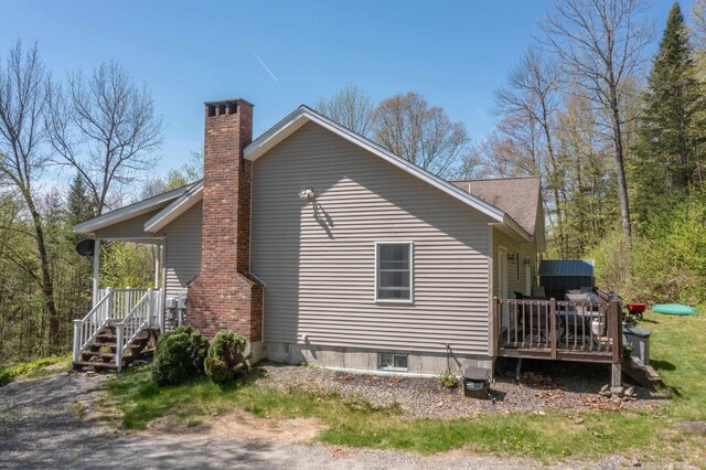 273 Berkshire Rd, Lisbon, NH 03585 - view of home's exterior with a chimney and a wooden deck