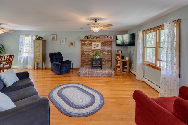 273 Berkshire Rd, Lisbon, NH 03585 - living room featuring ceiling fan, wood finished floors, and a baseboard radiator