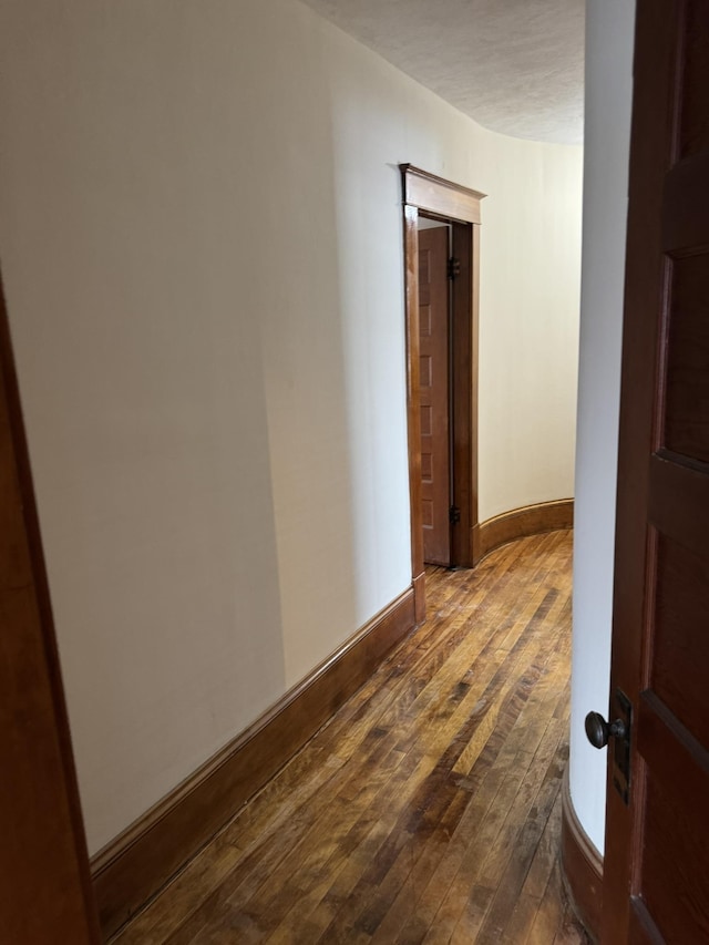 76 Center St, Richford, VT 05476 - hallway with dark wood-style flooring and baseboards
