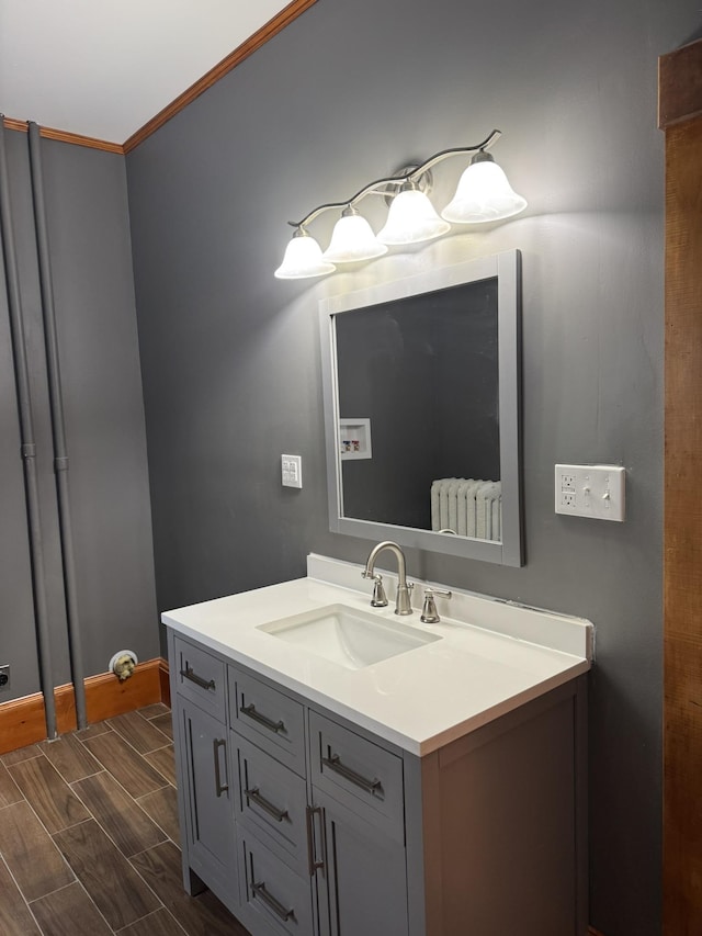 76 Center St, Richford, VT 05476 - bathroom featuring vanity and ornamental molding