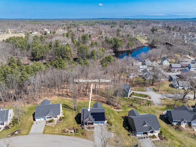 aerial overview of property's location with a large body of water and nearby suburban area