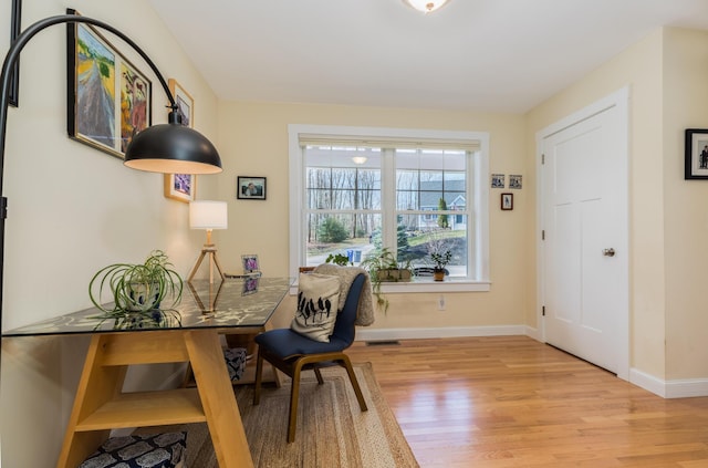 office with wood finished floors and baseboards