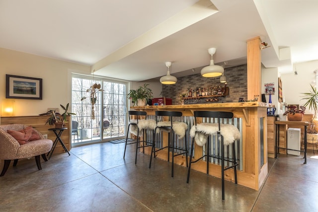 indoor dry bar with finished concrete flooring