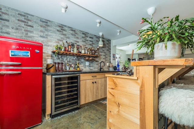 indoor wet bar featuring wine cooler, refrigerator, unfinished concrete flooring, and tasteful backsplash