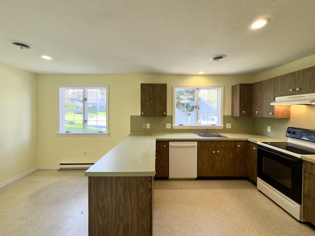 kitchen featuring range with electric cooktop, white dishwasher, under cabinet range hood, a sink, and a baseboard heating unit