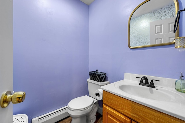 bathroom featuring baseboard heating, toilet, and vanity