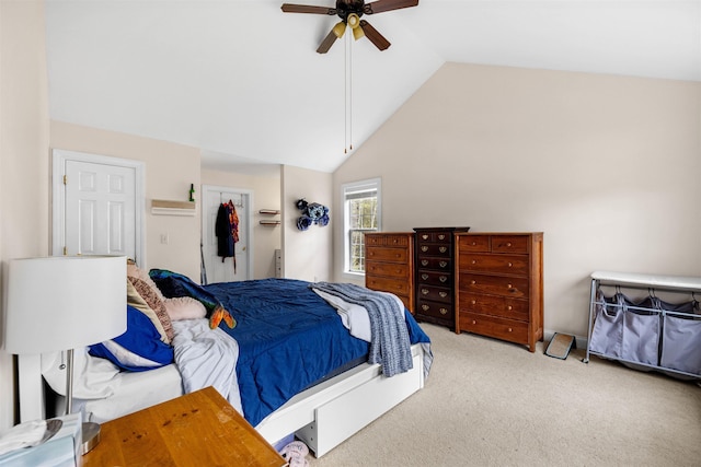 bedroom featuring carpet floors, vaulted ceiling, and a ceiling fan