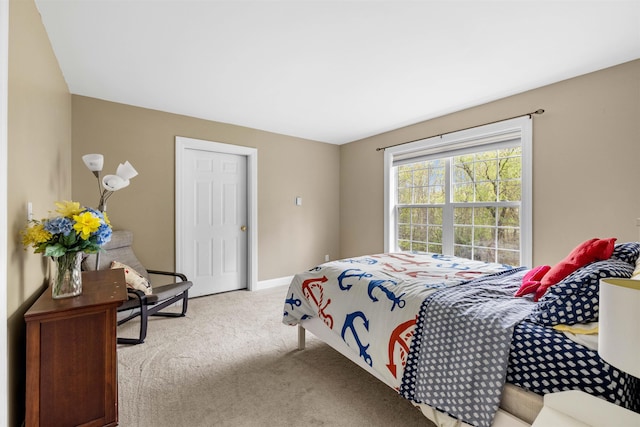 bedroom with carpet and baseboards