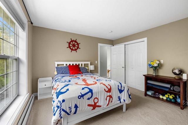 bedroom with carpet, a baseboard radiator, and a closet