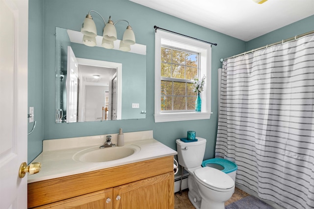 bathroom featuring vanity, toilet, a baseboard heating unit, and a shower with shower curtain