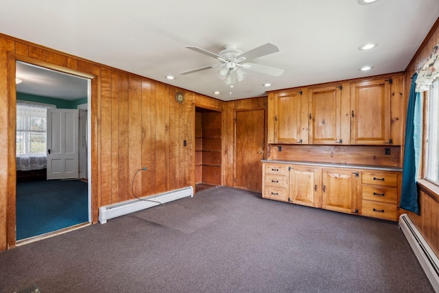 491 Brook Rd, Goshen, NH 03752 - unfurnished room with a baseboard heating unit, dark carpet, a ceiling fan, recessed lighting, and wood walls