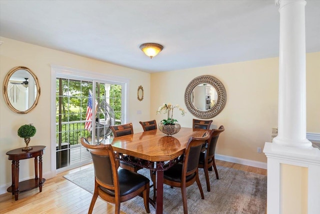 34 Coles Pond Rd, Somersworth, NH 03878 - dining space with decorative columns, light wood-style floors, and baseboards