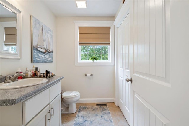 34 Coles Pond Rd, Somersworth, NH 03878 - bathroom with vanity, toilet, tile patterned flooring, and baseboards