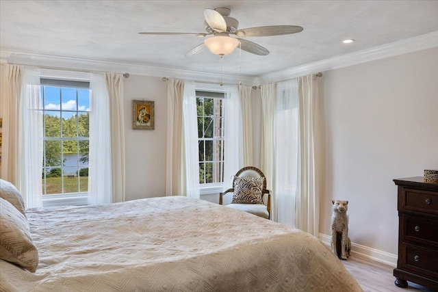 34 Coles Pond Rd, Somersworth, NH 03878 - bedroom featuring multiple windows, crown molding, baseboards, wood finished floors, and a ceiling fan
