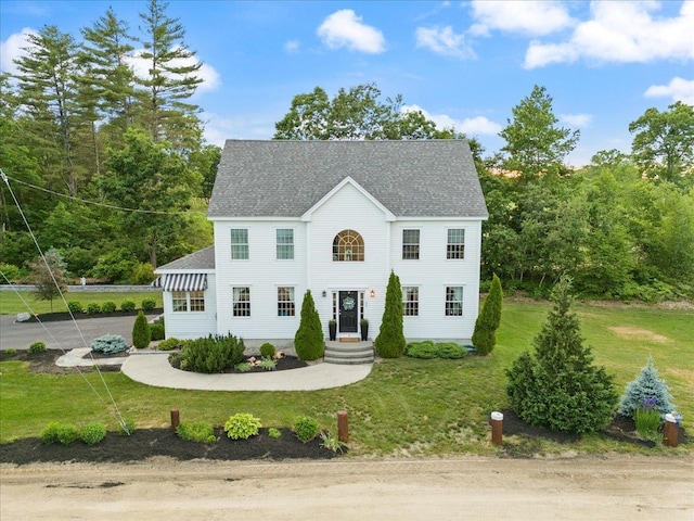 34 Coles Pond Rd, Somersworth, NH 03878 - colonial inspired home featuring a front lawn and roof with shingles