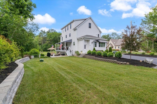 34 Coles Pond Rd, Somersworth, NH 03878 - rear view of property featuring a lawn