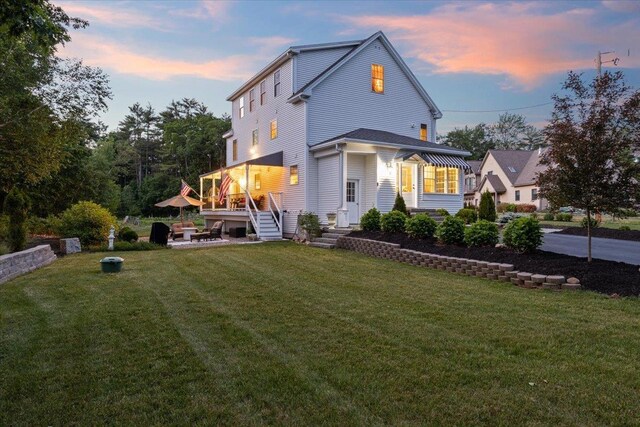 34 Coles Pond Rd, Somersworth, NH 03878 - view of front facade with a front lawn and a wooden deck
