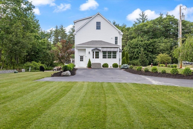 34 Coles Pond Rd, Somersworth, NH 03878 - rear view of house with asphalt driveway and a yard
