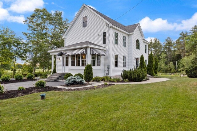 34 Coles Pond Rd, Somersworth, NH 03878 - view of property exterior featuring a yard and a shingled roof