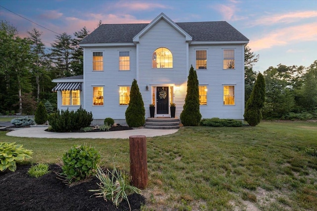 34 Coles Pond Rd, Somersworth, NH 03878 - colonial house featuring a front lawn and roof with shingles
