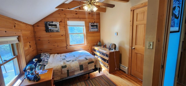 573 Granite Lake Rd, Nelson, NH 03457 - bedroom featuring vaulted ceiling, a baseboard radiator, light wood-style floors, wooden walls, and a ceiling fan