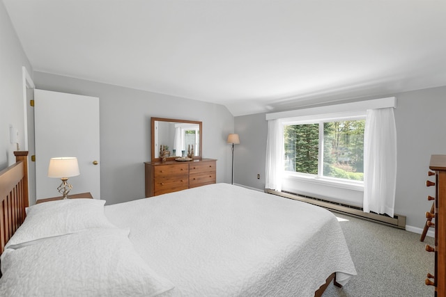 bedroom featuring baseboard heating, carpet, and baseboards
