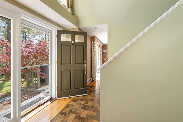entrance foyer featuring a baseboard heating unit