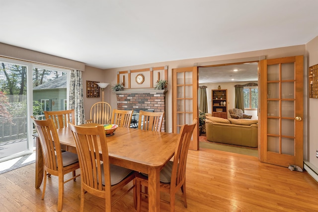 dining room with light wood-style flooring