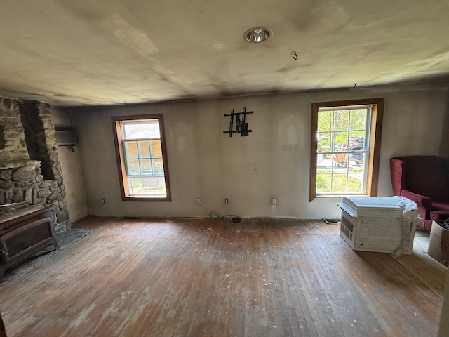 311 Clinton St, Concord, NH 03301 - living room featuring hardwood / wood-style floors, a fireplace, and heating unit