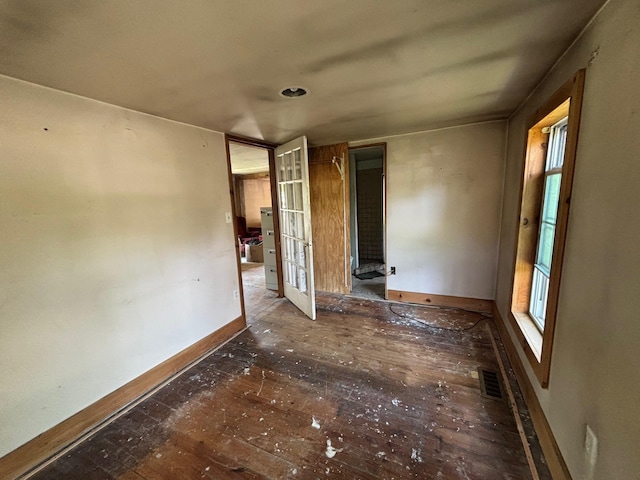 311 Clinton St, Concord, NH 03301 - unfurnished bedroom with hardwood / wood-style floors and baseboards