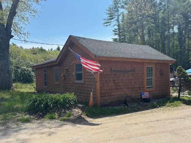 311 Clinton St, Concord, NH 03301 - view of side of home with roof with shingles