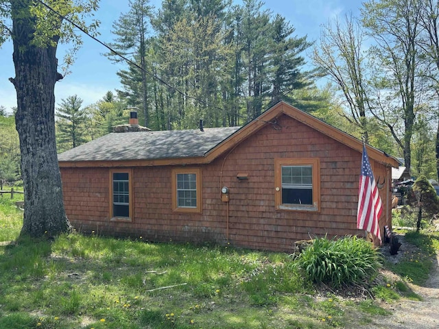 311 Clinton St, Concord, NH 03301 - view of home's exterior with roof with shingles