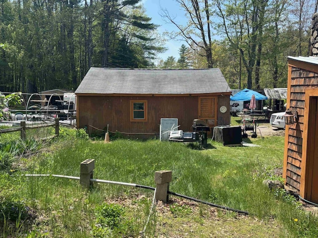 311 Clinton St, Concord, NH 03301 - view of outdoor structure featuring fence and an outbuilding