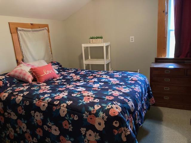 1413 Main St, Pittsburg, NH 03592 - carpeted bedroom featuring vaulted ceiling