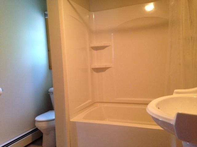1413 Main St, Pittsburg, NH 03592 - full bathroom with a baseboard heating unit, a sink, and toilet