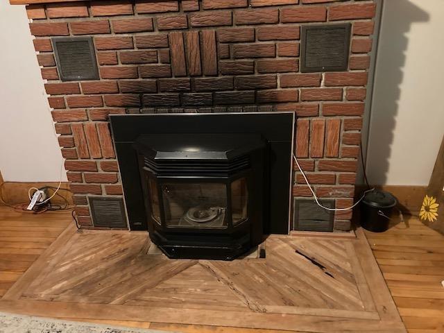 1413 Main St, Pittsburg, NH 03592 - detailed view of a wood stove